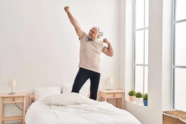 Middle Age Grey Haired Man Smiling Confident Dancing Bed Bedroom — Stockfoto