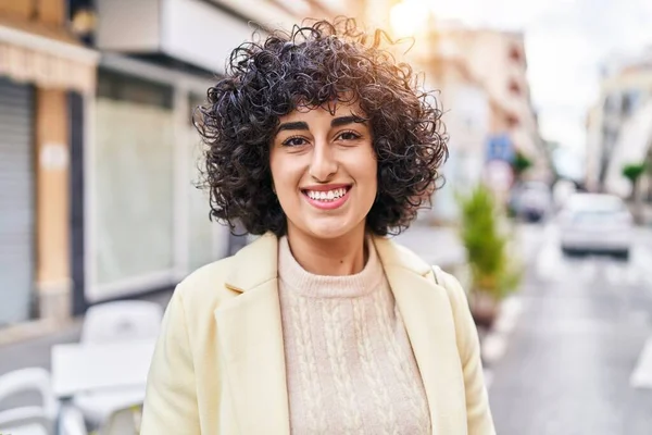 Young middle east woman excutive smiling confident standing at street