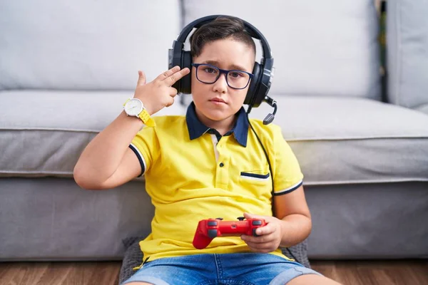 Young Hispanic Kid Playing Video Game Holding Controller Wearing Headphones — Stock Photo, Image