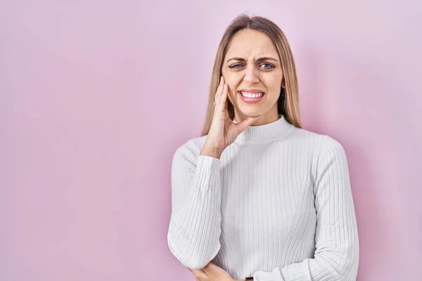 Young Blonde Woman Wearing White Sweater Pink Background Touching Mouth — Stock Photo, Image
