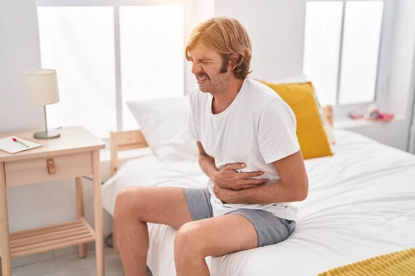 Young Blond Man Suffering Stomach Ache Sitting Bed Bedroom — Stock Photo, Image