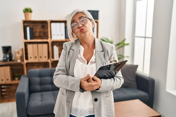 Middle Age Woman Grey Hair Consultation Office Looking Camera Blowing — Stock Photo, Image