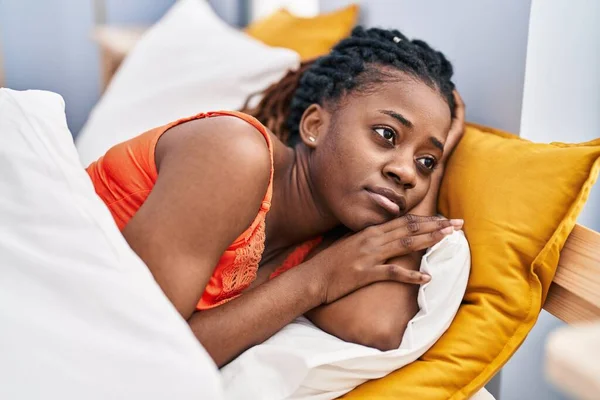 African American Woman Lying Bed Serious Expression Bedroom — Stok fotoğraf