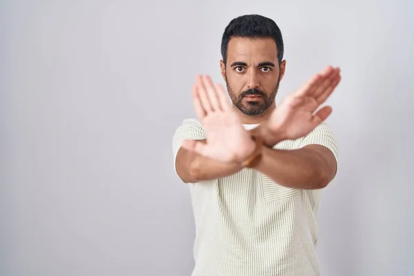 Hispanic Man Beard Standing Isolated Background Rejection Expression Crossing Arms —  Fotos de Stock