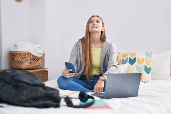 Young Caucasian Woman Using Smartphone Serious Expression Bedroom — Stock Photo, Image