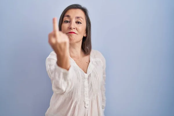 Middle Age Hispanic Woman Standing Blue Background Showing Middle Finger — 图库照片