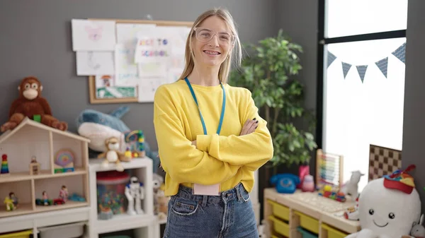 Young Blonde Woman Working Teacher Smiling Happy Kindergarten — Foto Stock
