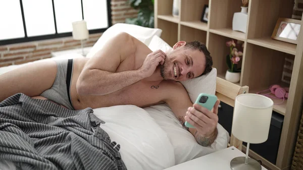 Young Caucasian Man Doing Video Call Smartphone Lying Bed Bedroom — Foto Stock
