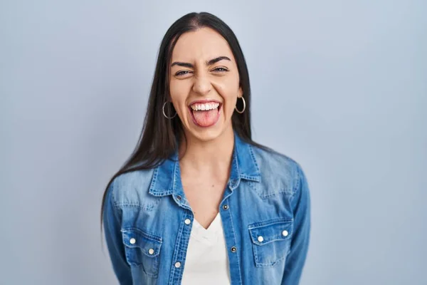 Hispanic Woman Standing Blue Background Sticking Tongue Out Happy Funny — 스톡 사진