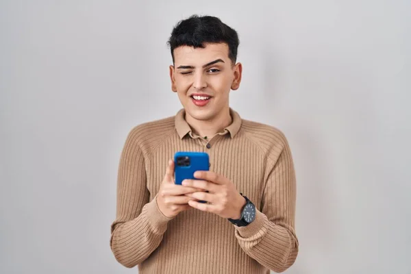 Non Binary Person Using Smartphone Typing Message Winking Looking Camera — Stock Photo, Image