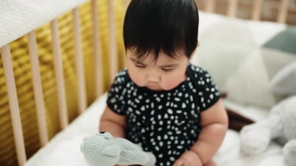 Adorable Hispanic Baby Holding Toy Sitting Cradle Bedroom — Stok video