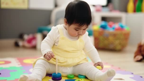 Adorable Hispanic Baby Playing Hoops Sitting Floor Kindergarten — Video Stock