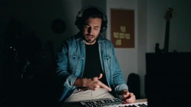 Young hispanic man artist smiling confident having video call at music studio