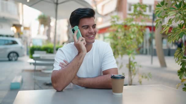 Young Hispanic Man Talking Smartphone Drinking Coffee Coffee Shop Terrace — Video