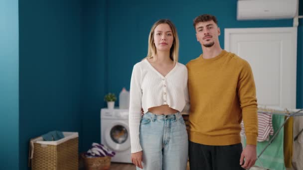 Young Couple Smiling Confident Hugging Each Other Laundry Room — Vídeo de Stock
