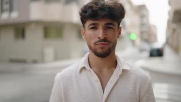 Young Arab Man Smiling Confident Doing Photo Gesture Hands Street — 图库视频影像