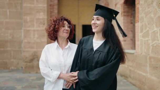 Two Women Mother Daughter Celebrating Graduation Walking Campus University — Stock Video