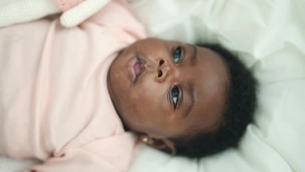 African American Baby Lying Bed Relaxed Expression Bedroom — Video