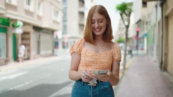 Young Redhead Woman Smiling Confident Counting Dollars Street — Stock video