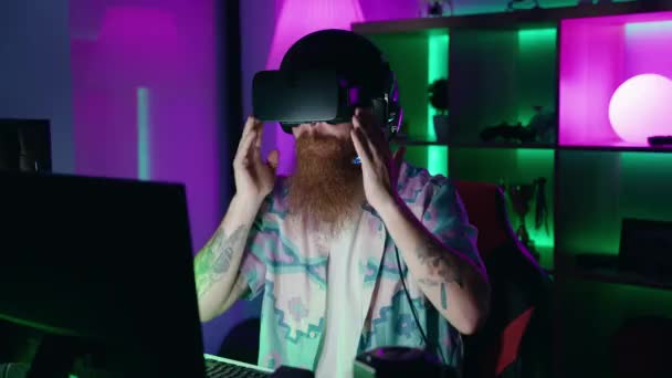Young Redhead Man Streamer Playing Video Game Using Virtual Reality — Stockvideo