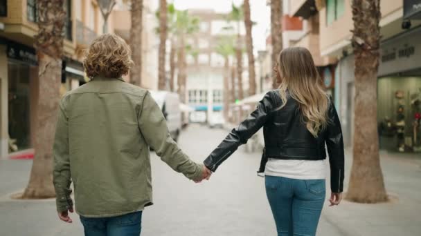 Young Caucasian Couple Smiling Confident Hugging Each Other Walking Street — Stock Video