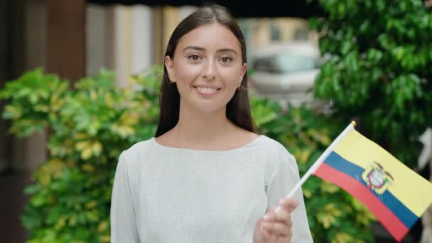 Young Beautiful Hispanic Woman Smiling Confident Holding Colombia Flag Street — 图库视频影像
