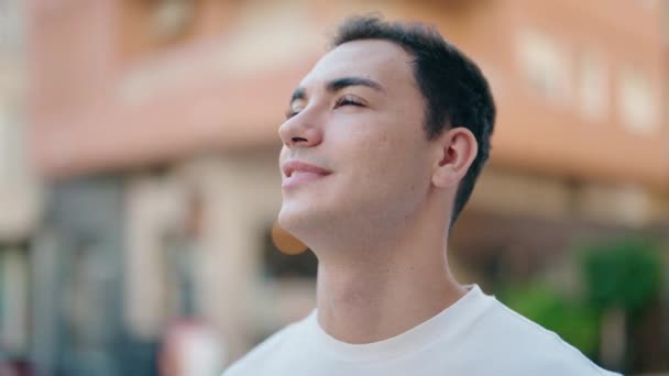 Young Hispanic Man Smiling Confident Looking Sky Street — Wideo stockowe