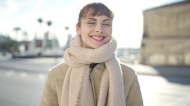 Young caucasian woman smiling confident pointing to herself at street