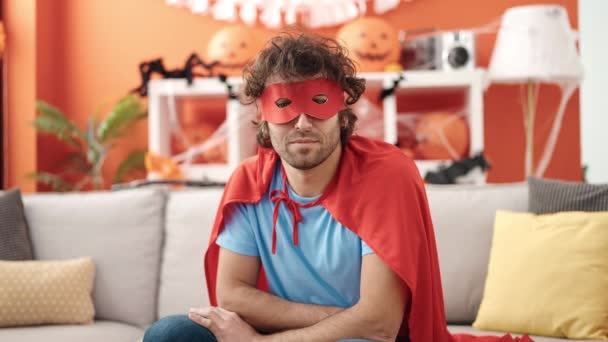 Young Hispanic Man Wearing Superhero Costume Having Halloween Party Home — Vídeos de Stock