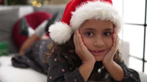 Adorable Hispanic Girl Smiling Confident Lying Sofa Christmas Tree Home — Video