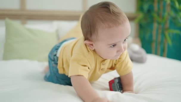 Adorable Hispanic Baby Playing Car Crawling Bed Bedroom — Stockvideo