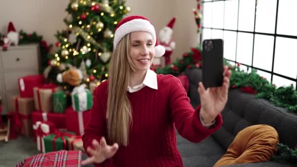 Young Blonde Woman Having Video Call Sitting Sofa Christmas Tree — Video Stock