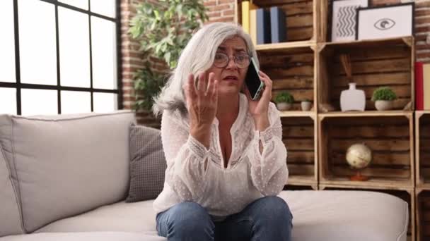 Middle Age Grey Haired Woman Worried Talking Smartphone Home — Stock Video