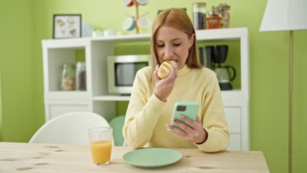 Young Blonde Woman Using Smartphone Having Breakfast Home — Stock video