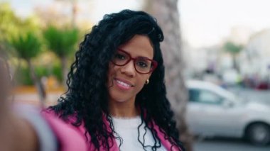 African american woman executive smiling confident having video call at street