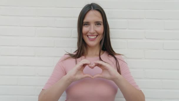 Young Beautiful Hispanic Woman Smiling Confident Doing Heart Gesture Hands — Stock videók