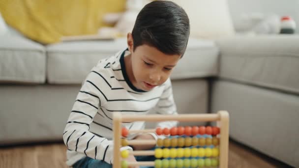 Adorable Hispanic Boy Playing Abacus Sitting Floor Home — Video Stock