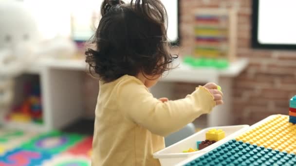 Adorable Hispanic Girl Playing Maths Puzzle Game Sitting Floor Kindergarten — Vídeo de Stock