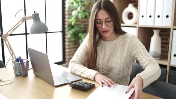 Young Beautiful Hispanic Woman Business Worker Using Laptop Reading Document — Video