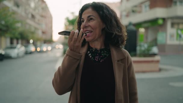 Middle Age Hispanic Woman Smiling Confident Sending Audio Message Street — Stockvideo
