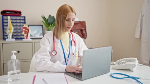 Young Blonde Woman Doctor Using Laptop Working Clinic — Video