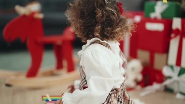 Adorable Hispanic Girl Playing Xylophone Sitting Floor Christmas Tree Home — Video