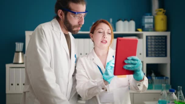 Man Woman Scientists Using Touchpad Working Laboratory — Stock video