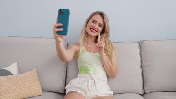 Young Beautiful Hispanic Woman Make Selfie Smartphone Sitting Sofa Home — Stock videók