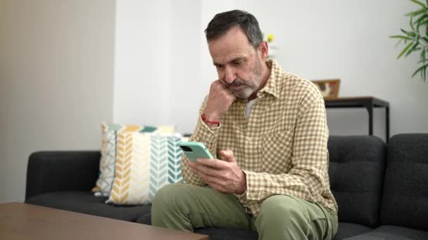 Middle Age Man Using Smartphone Sitting Sofa Home — Video Stock
