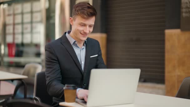 Young Caucasian Man Smiling Confident Using Laptop Coffee Shop Terrace — Stock Video