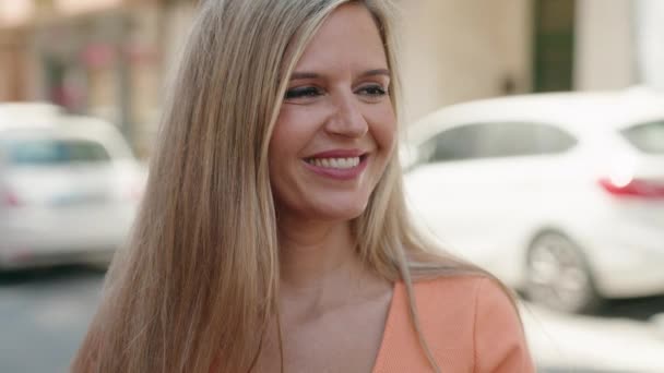 Young Blonde Woman Smiling Confident Looking Side Street — Video