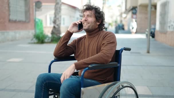 Young Hispanic Man Talking Smartphone Sitting Wheelchair Street — Stock videók