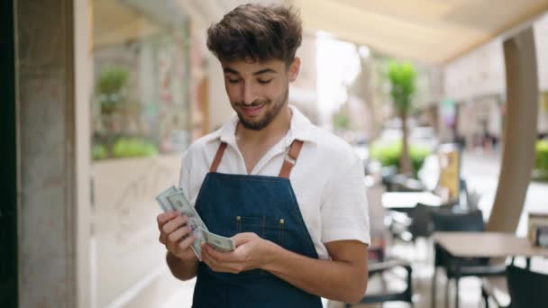 Young Arab Man Waiter Counting Dollars Working Restaurant — Vídeo de Stock