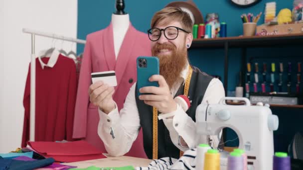 Young Redhead Man Tailor Using Smartphone Credit Card Clothing Factory — Stok video